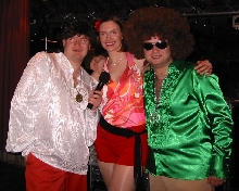 BFBS's Disco babes in full swing at the charity 70's night held recently at Af North's International Inn - Neil 'medallion' Carter, Jill 'hot pants' Misson and James 'hairy' Macdonald...